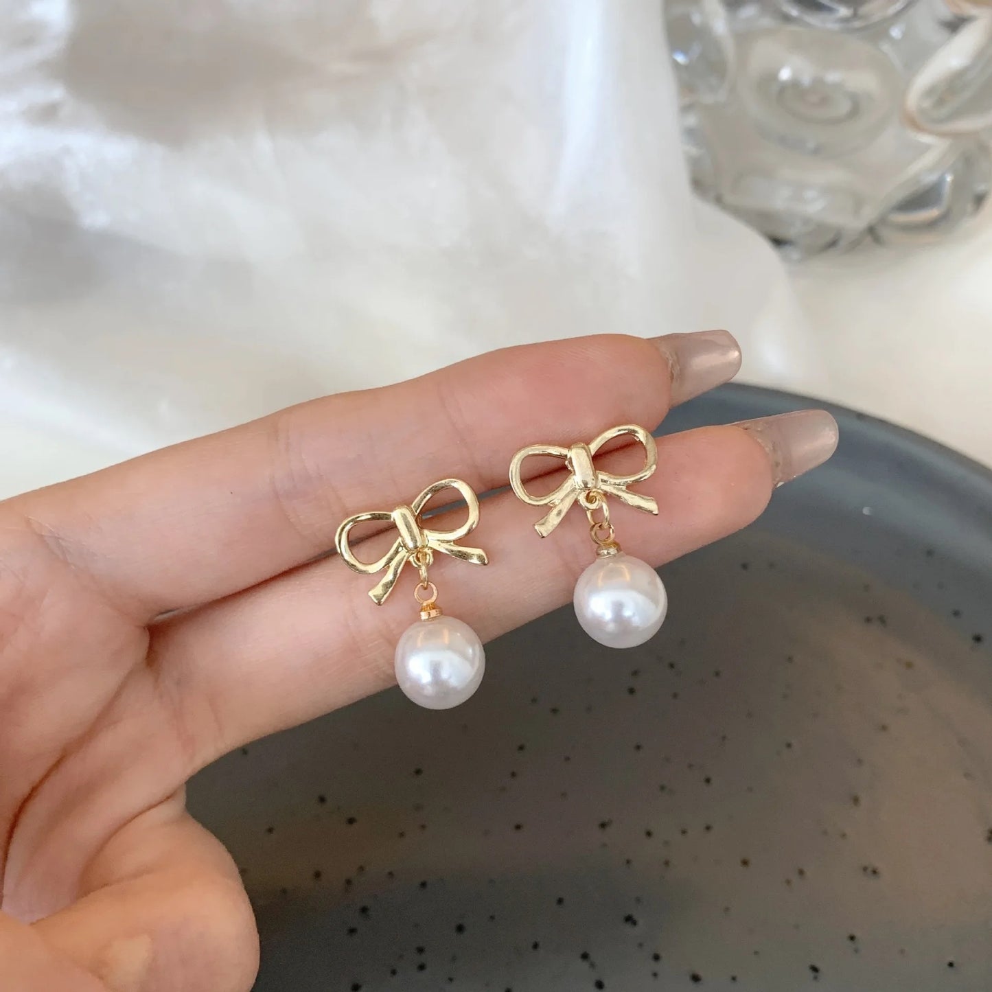 Gold Bow with Dangling Simulated Pearls Clip On Stud Earrings